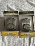2 Defiant Satin Nickel Spin To Lock Electronic Keypad Deadbolt Sealed. Fixed Price $85.00.