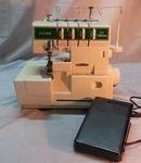 E-z Lock EZ100 4/3 Thread Serger Sewing Machine With Foot Pedal-used/works. Fixed Price $119.99.