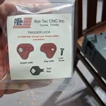 Kel-tec Trigger Lock Red Metal Plastic With Key Screw Single Pack. Fixed Price $14.99.