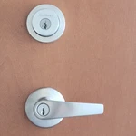 Kwikset Satin Chrome Delta Milan Keyed Entry Lever Door Lock Deadbolt Combo Pack. Fixed Price $44.99.