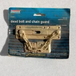 National Hardware N198-036 V1927 Dead Bolt And Chain Guard Solid Brass. Fixed Price $6.00.