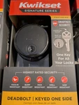 Kwikset Smartkey Uptown Black Round Single Cylinder Deadbolt, Door Lock. Fixed Price $21.99.